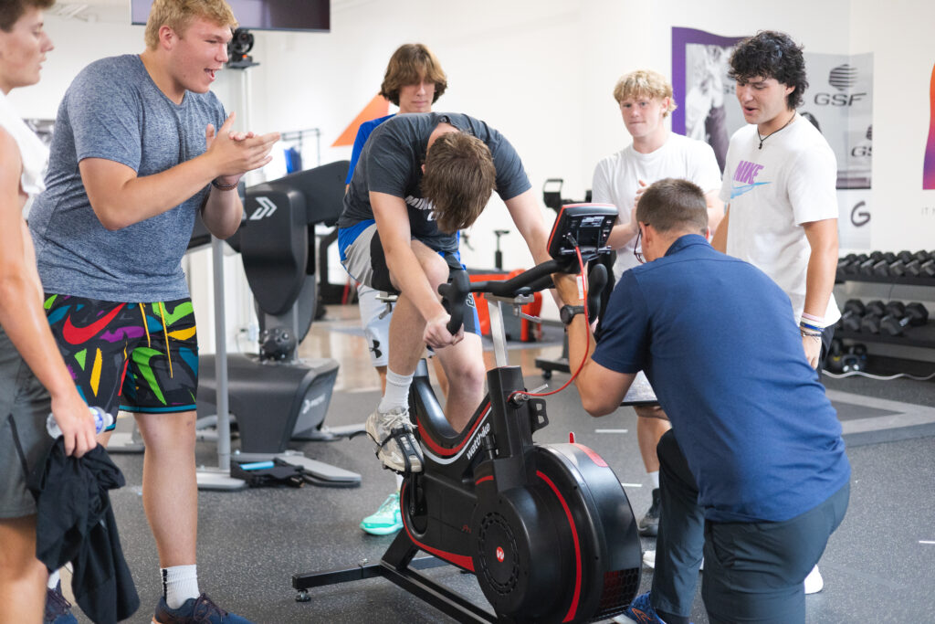 Varsity football player at the Academy of Holy Angels doing Wingate testing at Human Powered Health.